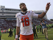 Syracuse quarterback Garrett Shrader (16) waves as he leaves the field after an NCAA college football game against Virginia Tech in Blacksburg Va., Saturday, Oct. 23 2021. (Matt Gentry/The Roanoke Times via AP)