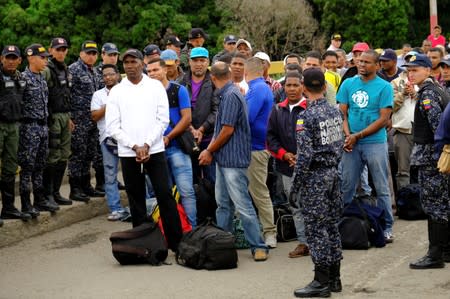 Members of Venezuelan security forces stand guard at the Simon Bolivar International Bridge