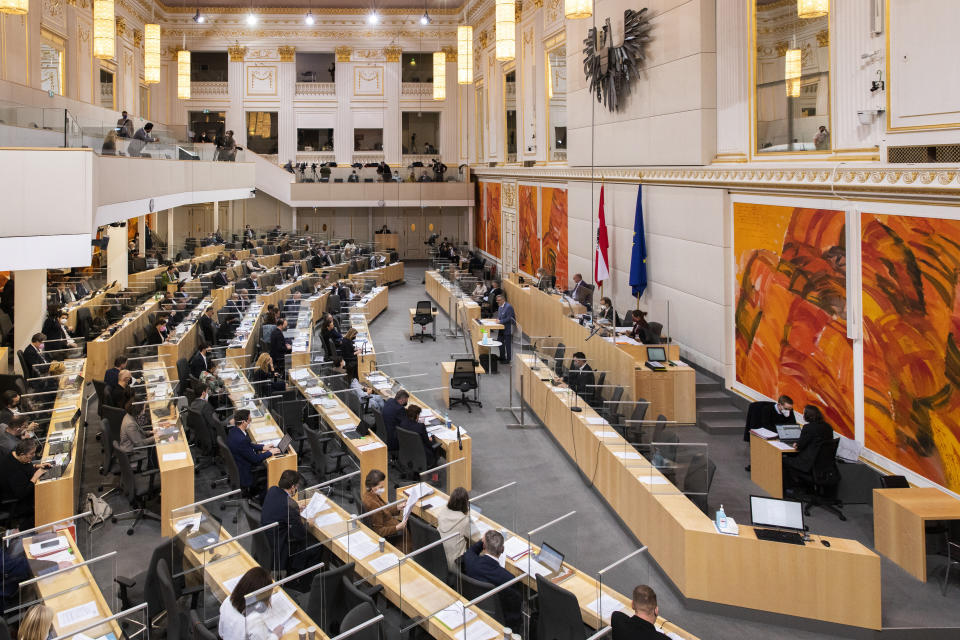 A view of the Austrian parliament in Vienna, Thursday, Jan. 20, 2022. Austria’s parliament is due to vote on introducing a COVID-19 vaccine mandate for adults, the first of its kind in Europe. The mandate would apply to all residents of Austria age 18 and over, with exemptions for pregnant women, individuals who for medical reasons can’t be vaccinated, and people who have recovered from a coronavirus infection in the past six months. (AP Photo/Lisa Leutner)