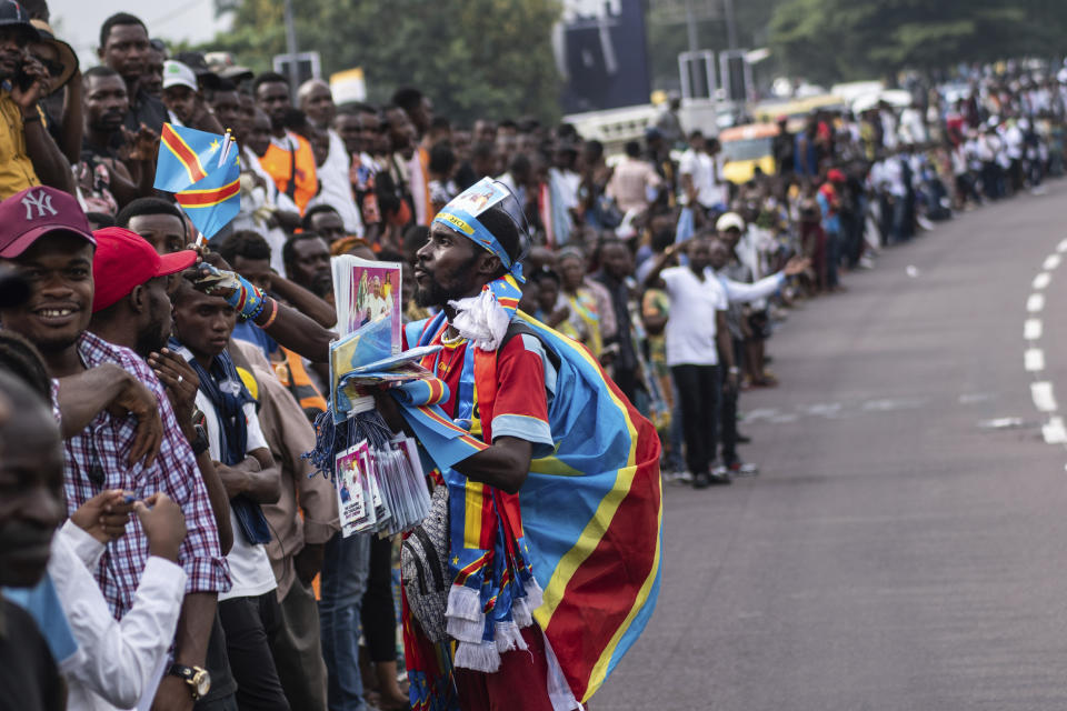 Well-wishers wait for Pope Francis in Kinshasa, Congo, Tuesday Jan. 31, 2023. Francis is in Congo and South Sudan for a six-day trip, hoping to bring comfort and encouragement to two countries that have been riven by poverty, conflicts and what he calls a "colonialist mentality" that has exploited Africa for centuries. (AP Photo/Samy Ntumba Shambuyi)