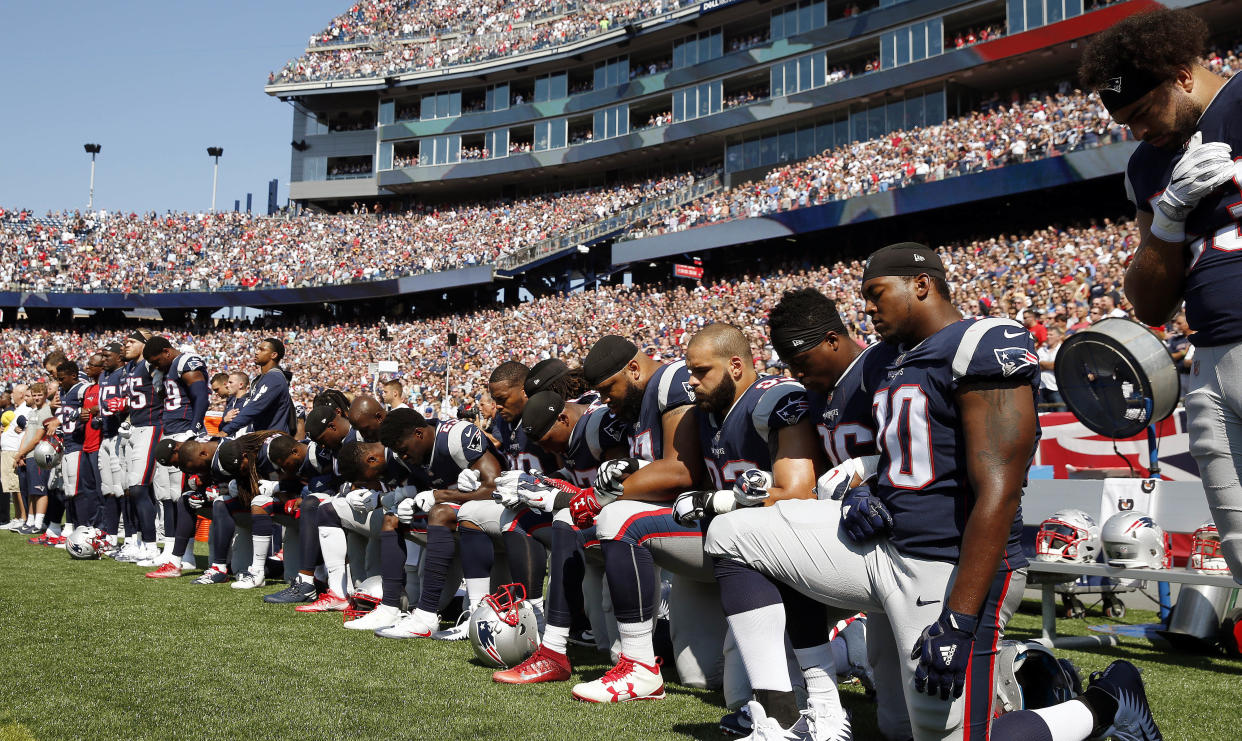 Several New England Patriots players kneel during the national anthem before an NFL football game against the Houston Texans, Sunday, Sept. 24, 2017, in Foxborough, Mass. (AP Photo/Michael Dwyer)