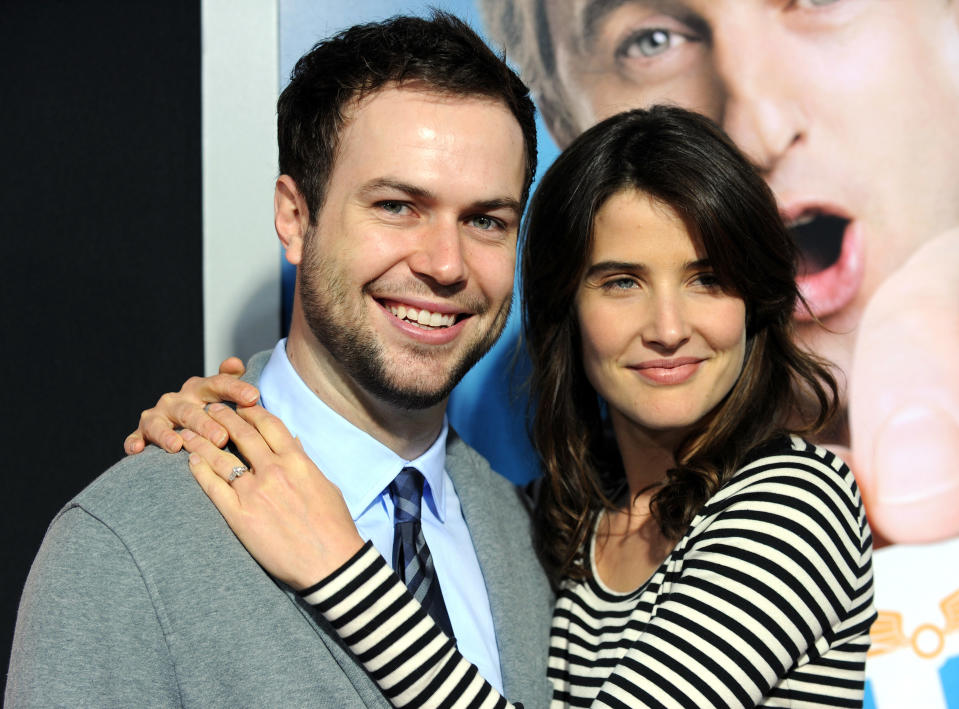 closeup of Cobie with her arms around Taran