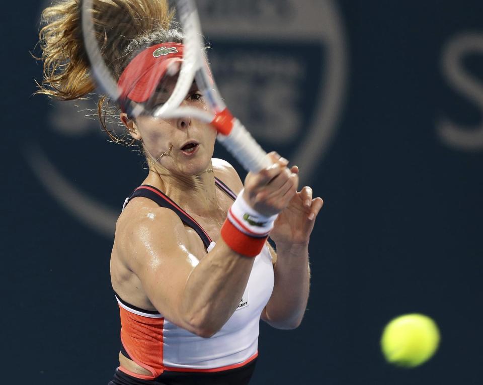 Alize Cornet of France plays a shot in her final match against Karolina Pliskova of the Czech Republic at the Brisbane International tennis tournament in Brisbane, Australia, Saturday, Jan. 7, 2017. (AP Photo/Tertius Pickard)