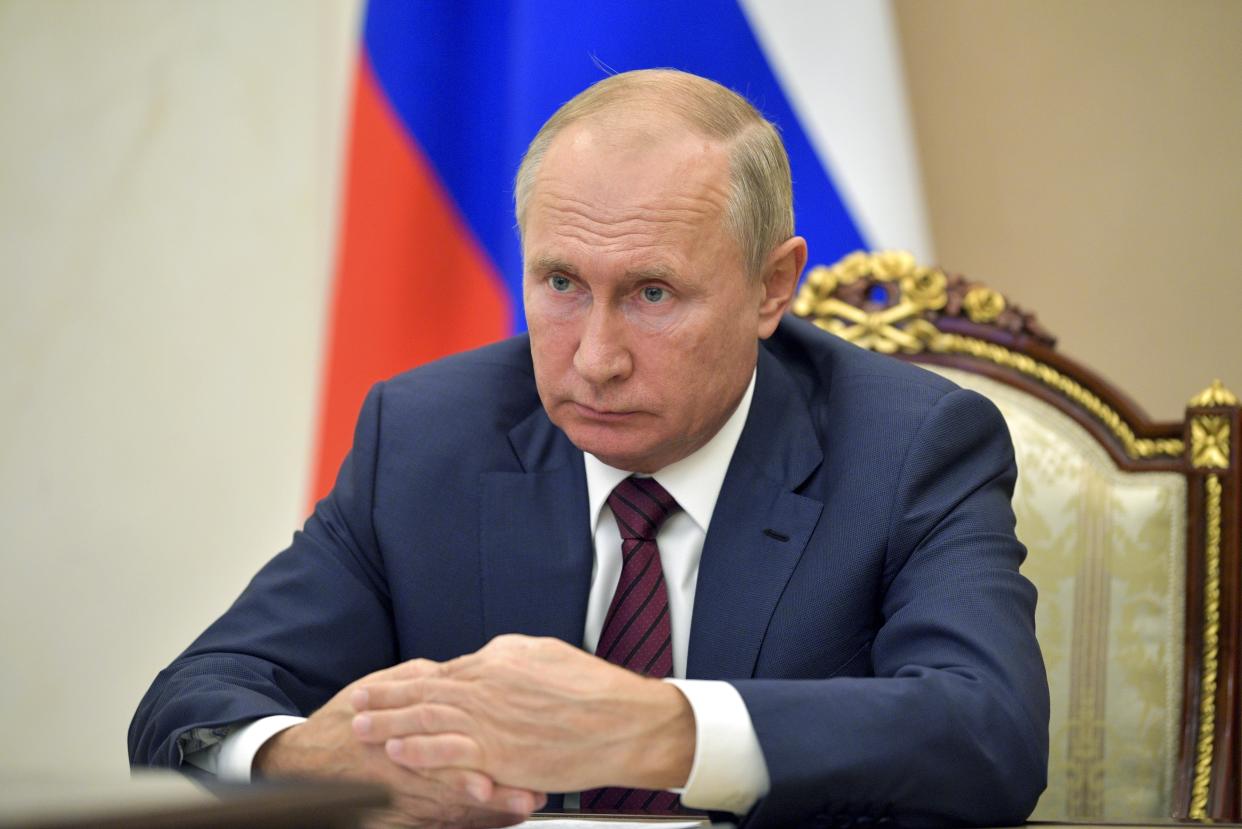 <p>Russian president Vladimir Putin attends a meeting via video conference in Moscow, Russia, in November</p> (AP)