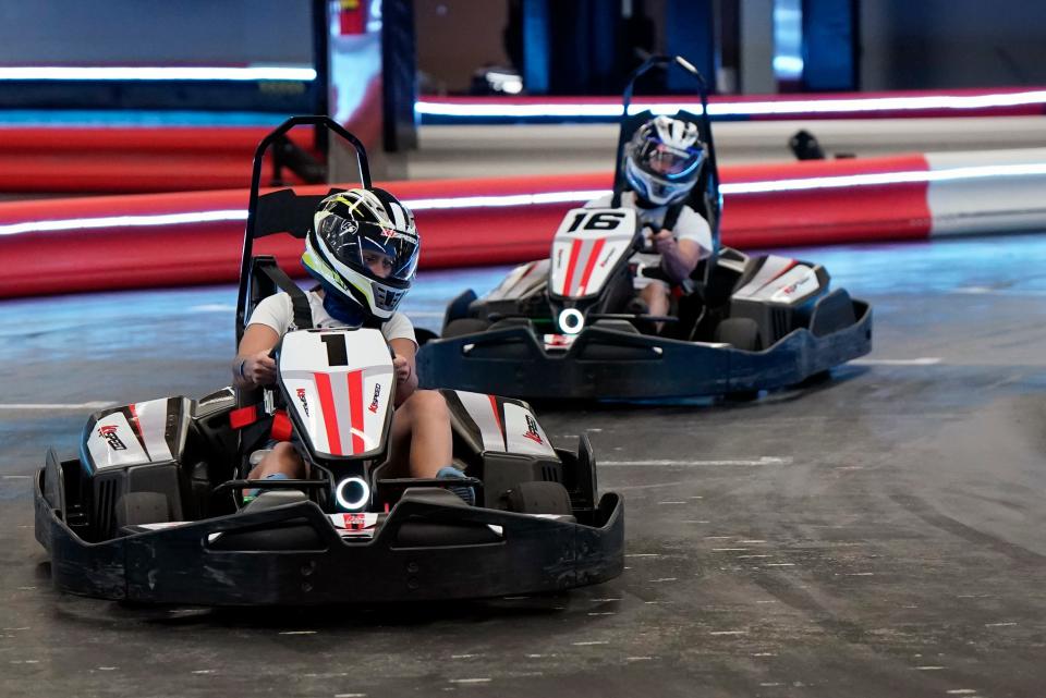 Racers speed through the course at K1 Speed Indoor Go-Kart Racing at Volusia Square mall in Daytona Beach. The go-kart attraction is just 1/2-mile east of Daytona International Speedway.