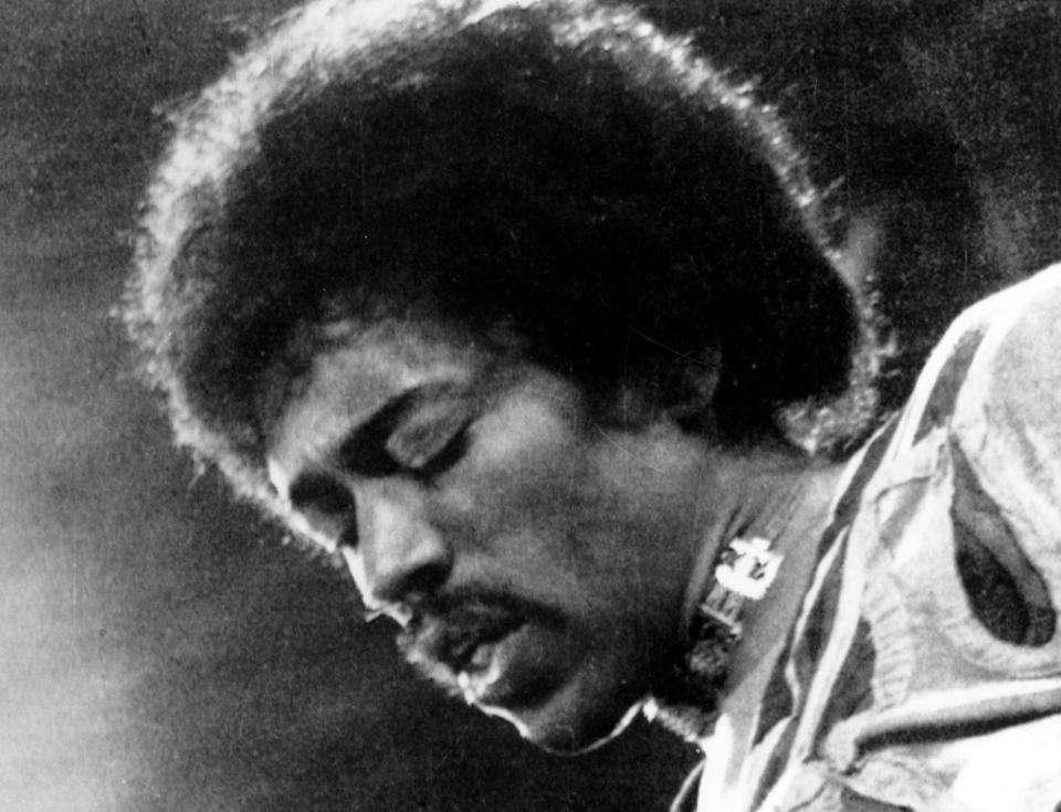 FILE- In this 1970 file photo, Jimi Hendrix performs on the Isle of Wight in England. Rock 'n' roll will never die, but it's a hazardous occupation. A new study confirms that rock and pop musicians more often die prematurely than the general population, and an early death is twice as likely for solo musicians than for members of bands. (AP Photo/file)