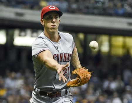 Sep 18, 2018; Milwaukee, WI, USA; Cincinnati Reds pitcher Michael Lorenzen (21) tosses out Milwaukee Brewers left fielder Christian Yelich (not pictured) in the third inning at Miller Park. Mandatory Credit: Benny Sieu-USA TODAY Sports