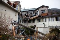 A destroyed building, moved by the tsunami, is seen in Onagawa, Miyagi prefecture. Radiation levels have surged in seawater near a tsunami-stricken nuclear power station in Japan, officials said Saturday, as engineers battled to stabilise the plant in hazardous conditions