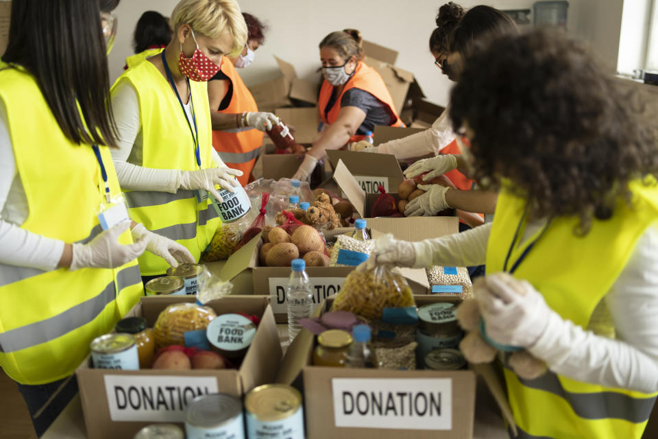 Food bank volunteers sorting donations