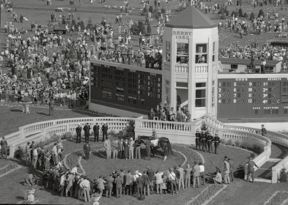 Hill Gail and Eddie Arcaro stand in the Winner's Circle.