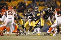 Dec 15, 2013; Pittsburgh, PA, USA; Pittsburgh Steelers running back Le'Veon Bell (26) carries the ball against the Cincinnati Bengals during the third quarter at Heinz Field. The Steelers won 30-20. Mandatory Credit: Charles LeClaire-USA TODAY Sports