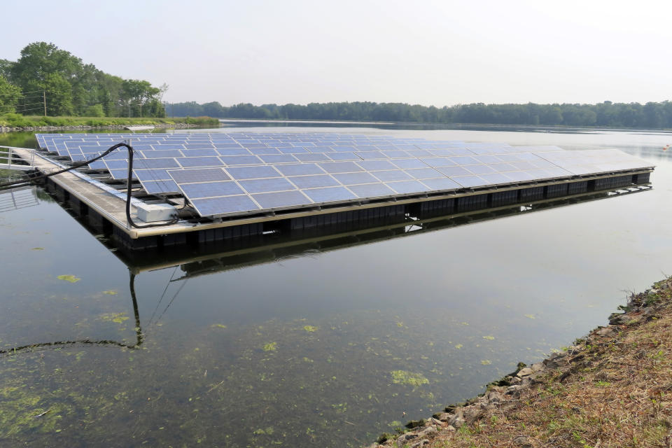 Solar panels from a smaller pilot project are shown, Tuesday, June 6, 2023, a water treatment plant in Millburn, N.J., where a larger array of floating solar panels provides enough electricity to power 95% of the treatment facilities electrical needs. (AP Photo/Wayne Parry)