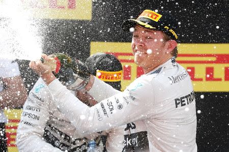 Formula One - F1 - Spanish Grand Prix 2015 - Circuit de Catalunya, Barcelona, Spain - 10/5/15 Mercedes' Nico Rosberg celebrates his win on the podium Reuters / Juan Medina