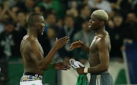 Soccer Football - Saint-Etienne v Manchester United - UEFA Europa League Round of 32 Second Leg - Stade Geoffroy-Guichard, Saint-Etienne, France - 22/2/17 Manchester United's Paul Pogba and St Etienne's Florentin Pogba swap shirts after the match Action Images via Reuters / Andrew Boyers Livepic