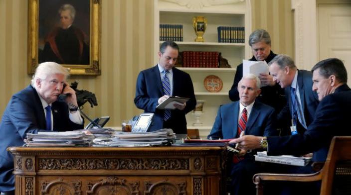 Trump, joined by Chief of Staff Reince Priebus, Vice President Mike Pence, Senior Advisor Steve Bannon, press secretary Sean Spicer and National Security Advisor Michael Flynn, speaks by phone with Russian President Vladimir Putin in the Oval Office last month. (Jonathan Ernst/Reuters)