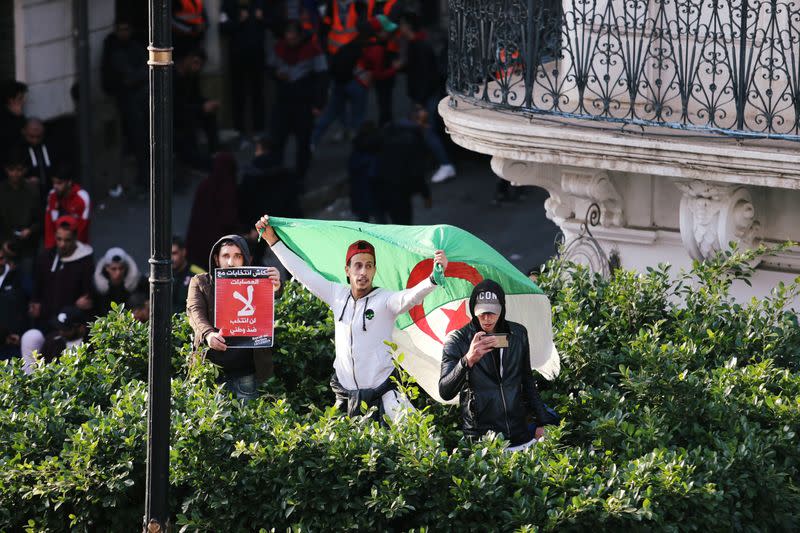 Demonstrators shout slogans during a protest to reject the presidential election in Algiers,