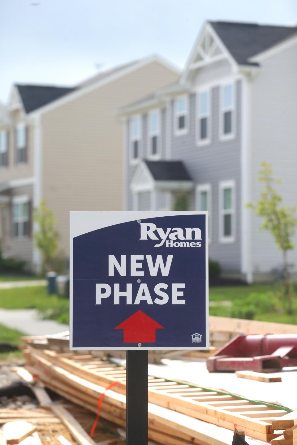 A sign points to the new phase of homes being built in the East New Haven development off Fairland Road on Thursday in Barberton.