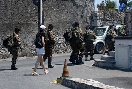 Italian Army officers walk in Taormina, Italy, May 23, 2017. REUTERS/Antonio Parrinello