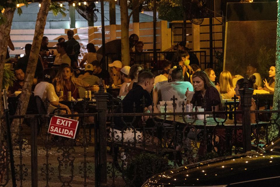 The patio of O'Shea's Irish Pub in the Highlands neighborhood of Louisville, Ky., remains a popular gathering spot Friday night despite the COVID-19 crisis.