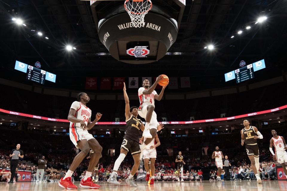 Nov 19, 2023; Columbus, OH, USA;
Ohio State Buckeyes guard Dale Bonner (4) goes for a layup against Western Michigan Broncos guard B. Artis White (3) during their game on Sunday, Nov. 19, 2023 at the Value City Arena.