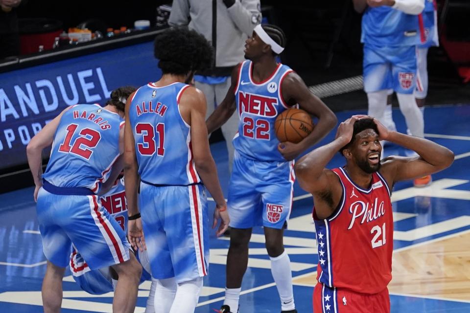 Philadelphia 76ers' Joel Embiid (21) reacts to a foul called on him during the second half of the team's NBA basketball game against the Brooklyn Nets on Thursday, Jan. 7, 2021, in New York. (AP Photo/Frank Franklin II)