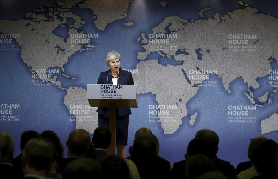 Britain's Prime Minister Theresa May speaks at Chatham House in London, Wednesday July 17, 2019. Prime Minister Theresa May says she worries about the increasing "absolutism" of world politics, in a message many will see as aimed at her successor as Britain's leader and President Donald Trump. (Henry Nicholls/Pool via AP)