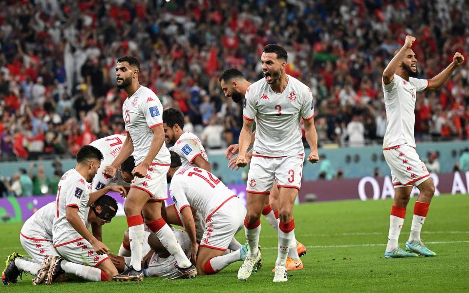 Wahbi Khazri of Tunisia celebrates with teammates after scoring their team's first goal during the FIFA World Cup Qatar 2022 Group D match between Tunisia and France at Education City Stadium on November 30, 2022 in Al Rayyan, Qata - Clive Mason/Getty Images