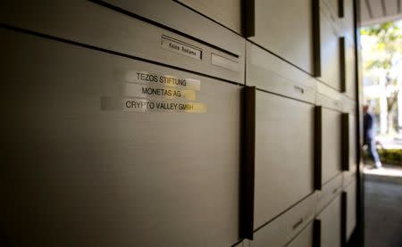 The names of Tezos Stiftung foundation and the companies Monetas AG and Crypto Valley GmbH are seen on a post box at an office building in Zug, Switzerland October 5, 2017. Picture taken October 5, 2017. REUTERS/Arnd Wiegmann