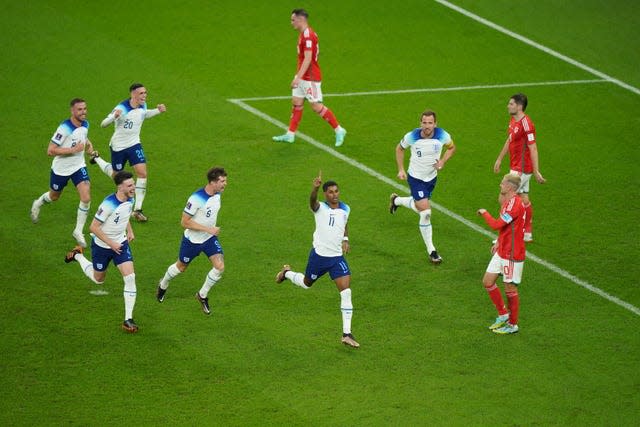 Marcus Rashford celebrates the first of his two goals – a powerful free-kick - in England's 3-0 World Cup win over Wales. The comfortable success for Gareth Southgate's men secured top spot in Group B and set up a last-16 meeting with Senegal, while simultaneously eliminating rivals Wales. Despite his standout display, Manchester United forward Rashford was only afforded a further 30 minutes of action in the tournament. Euro 2020 finalists England dispatched Senegal 3-0 but crashed out following a 2-1 quarter-final defeat to France