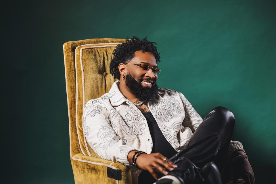 Pastor Mike Jr. smiling in chair