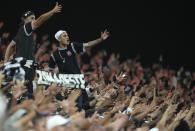 Fans of Corinthians cheer during a Sao Paulo championship Women's soccer final match against Sao Paulo at Neo Quimica arena in Sao Paulo, Brazil, Wednesday, Dec. 8, 2021. (AP Photo/Andre Penner)
