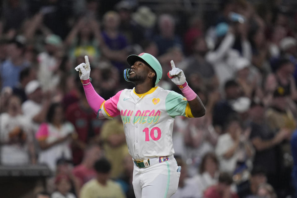 San Diego Padres' Jurickson Profar celebrates after hitting a home run during the ninth inning of a baseball game against the Arizona Diamondbacks, Friday, July 5, 2024, in San Diego. (AP Photo/Gregory Bull)