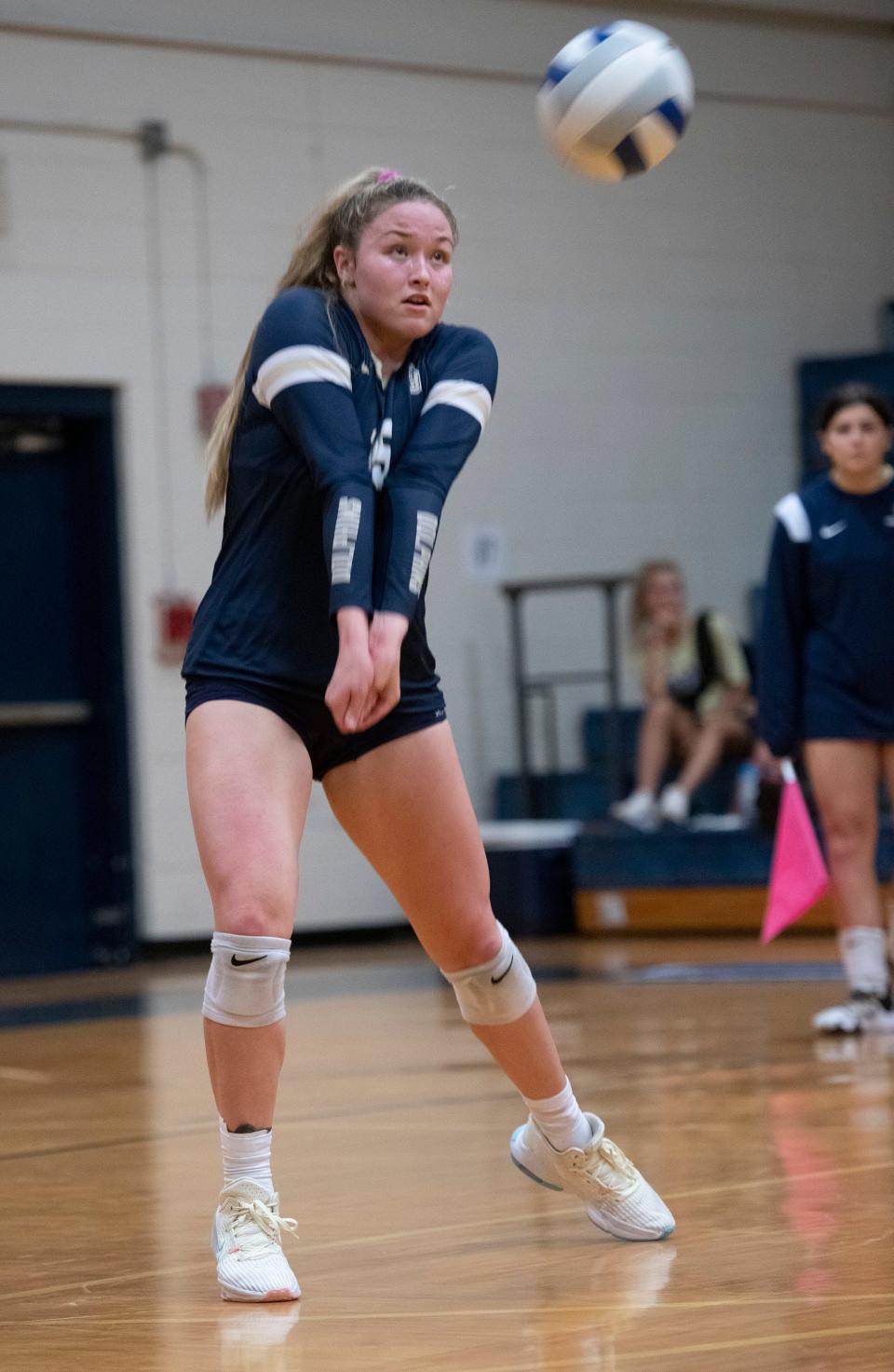 Gulf Breeze High's Bella Satterwhite (No. 15) digs serve during Wednesday's match against Sneads High. Gulf Breeze defeated Sneads in three straight. 