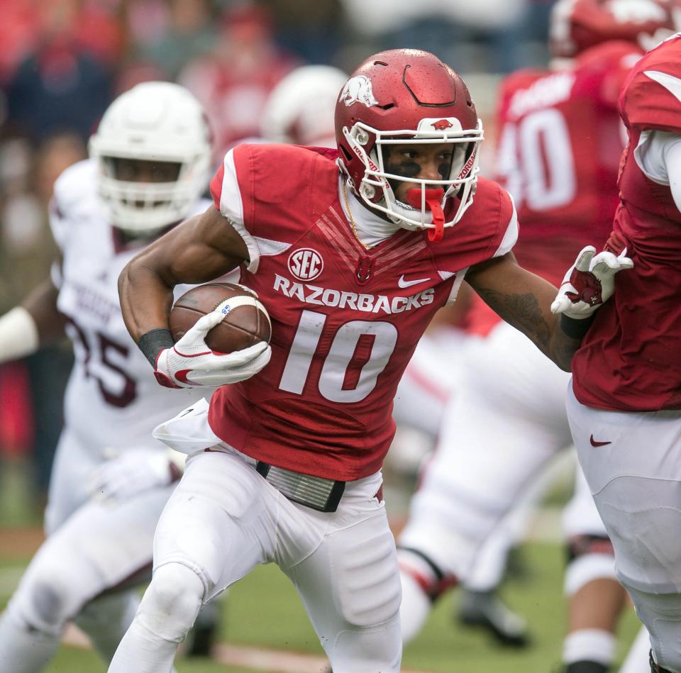 Nov 18, 2017; Fayetteville, AR, USA; Arkansas Razorbacks wide receiver Jordan Jones (10) runs the ball on an end around during the fourth quarter of the game against Mississippi State Bulldogs at Donald W. Reynolds Razorback Stadium. Mississippi State Bulldogs won 28-21. Mandatory Credit: Brett Rojo-USA TODAY Sports