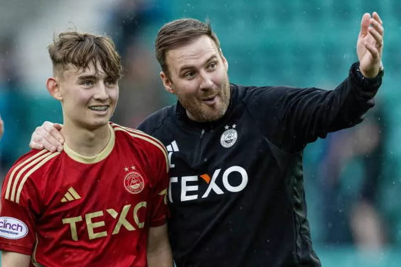 Aberdeen caretaker manager Peter Leven celebrates their 4-0 win over Hibs with Fletcher Boyd