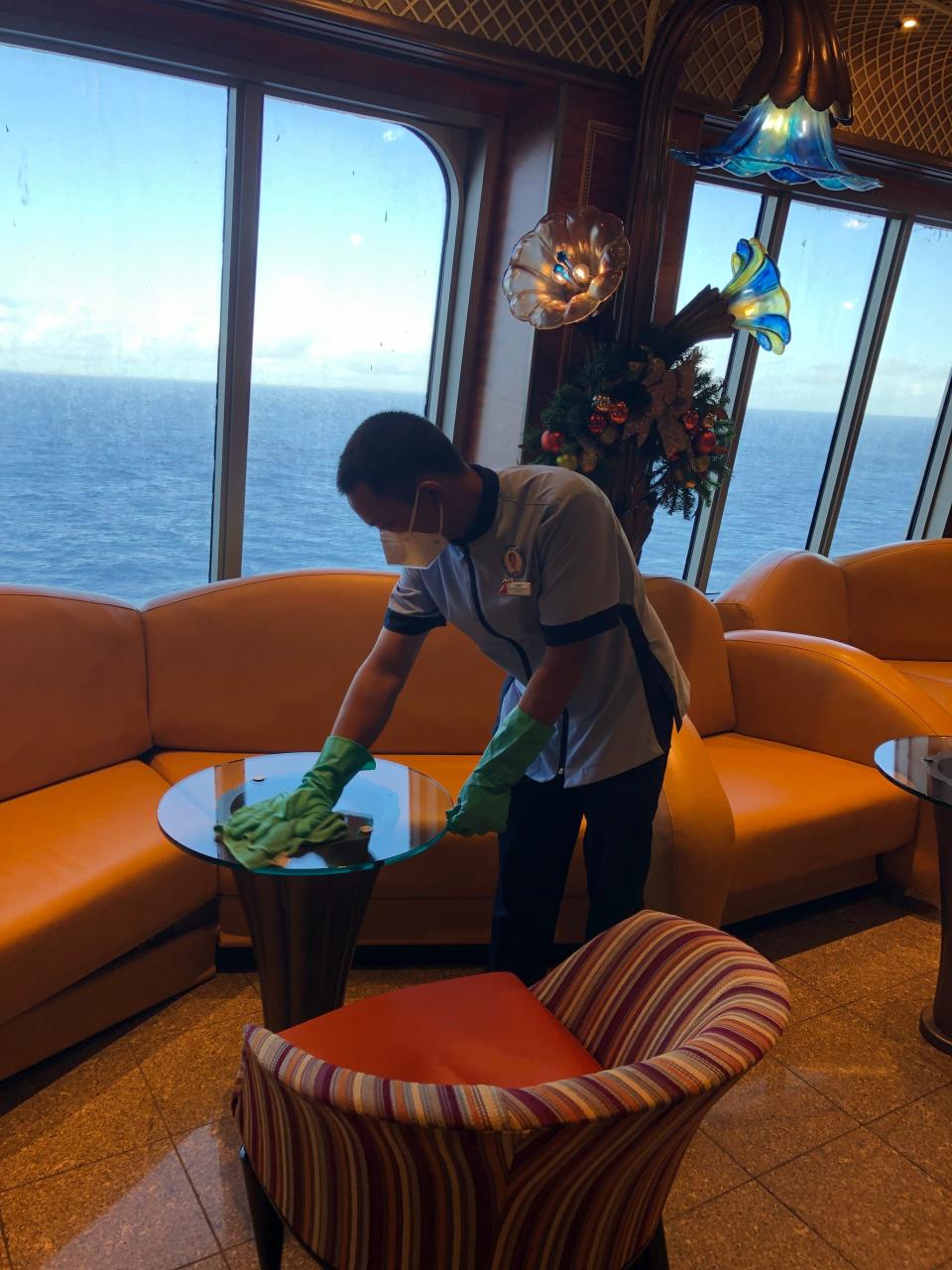 Carnival crew members are seen frequently wiping down, scrubbing and disinfecting everything from banquet seating and stairway handrails to elevator walls and dining room furniture.