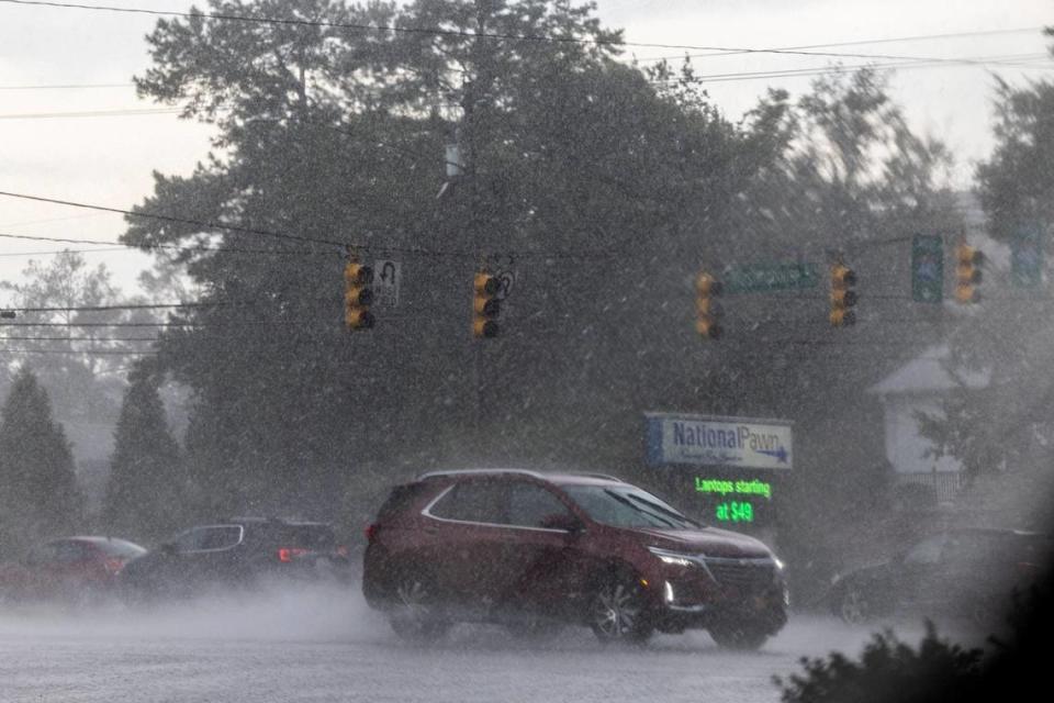 Drivers navigate the intersection of Capital and Westinghouse Boulevards in Raleigh as streetlights were out during a severe thunderstorm that swept through the Triangle on Tuesday afternoon, Aug 15, 2023. Travis Long/tlong@newsobserver.com