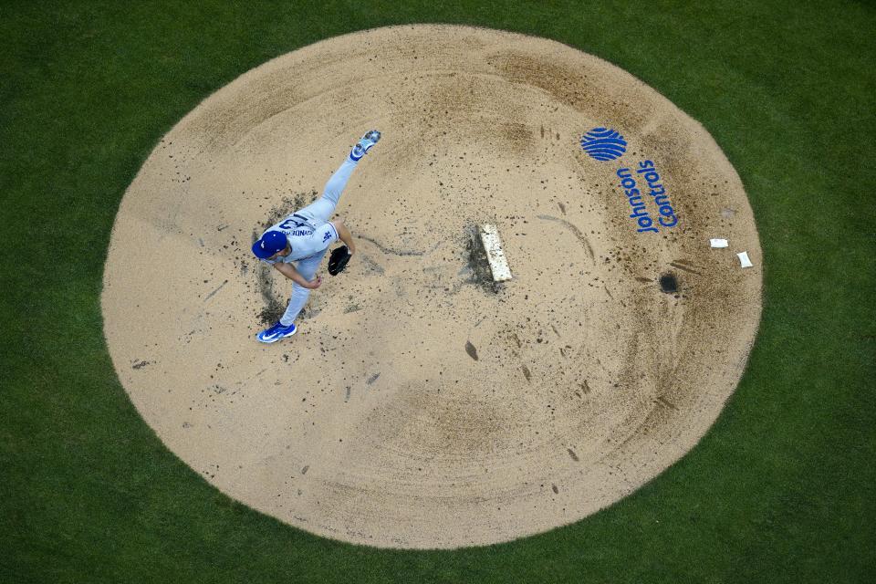 Los Angeles Dodgers starting pitcher Noah Syndergaard throws during the first inning of a baseball game against the Milwaukee Brewers Tuesday, May 9, 2023, in Milwaukee. (AP Photo/Morry Gash)