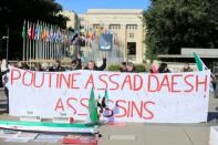 People demonstrating against Syria's President Bashar al-Assad's government hold a banner during the Geneva IV conference on Syria on the Place des Nations in front of the United Nations in Geneva, Switzerland, February 25, 2017. REUTERS/Pierre Albouy