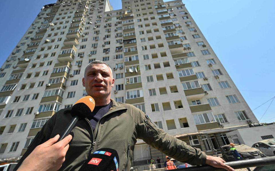 Mayor of Kyiv, Vitali Klitschko, addresses media in front of a multi-storey residential building partially destroyed after an overnight drone attack in Kyiv - GENYA SAVILOV/AFP