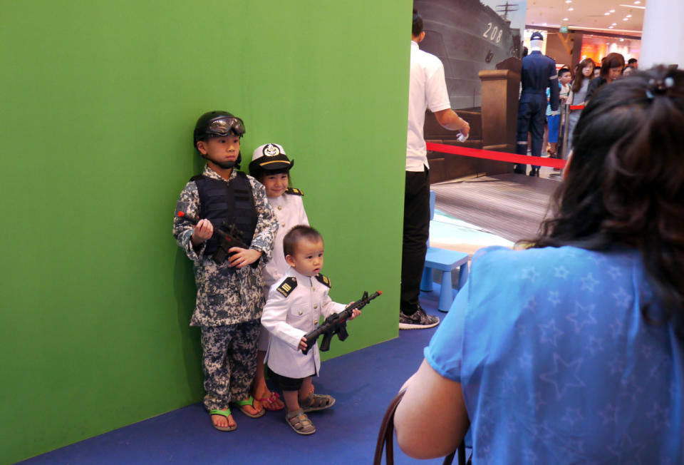 Children dressed in naval attire posing for a picture. (Photo: Dhany Osman/Yahoo Newsroom)