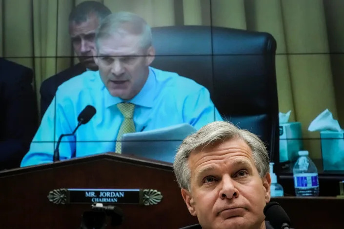 FBI Director Christopher Wray listens to House Judiciary Committee Chairman Jim Jordan, R-Ohio, during a hearing on July 12, 2023.