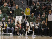 Milwaukee Bucks players react during the first half of the team's NBA basketball game against the Washington Wizards on Tuesday, Jan. 28. 2020, in Milwaukee. (AP Photo/Jeffrey Phelps)