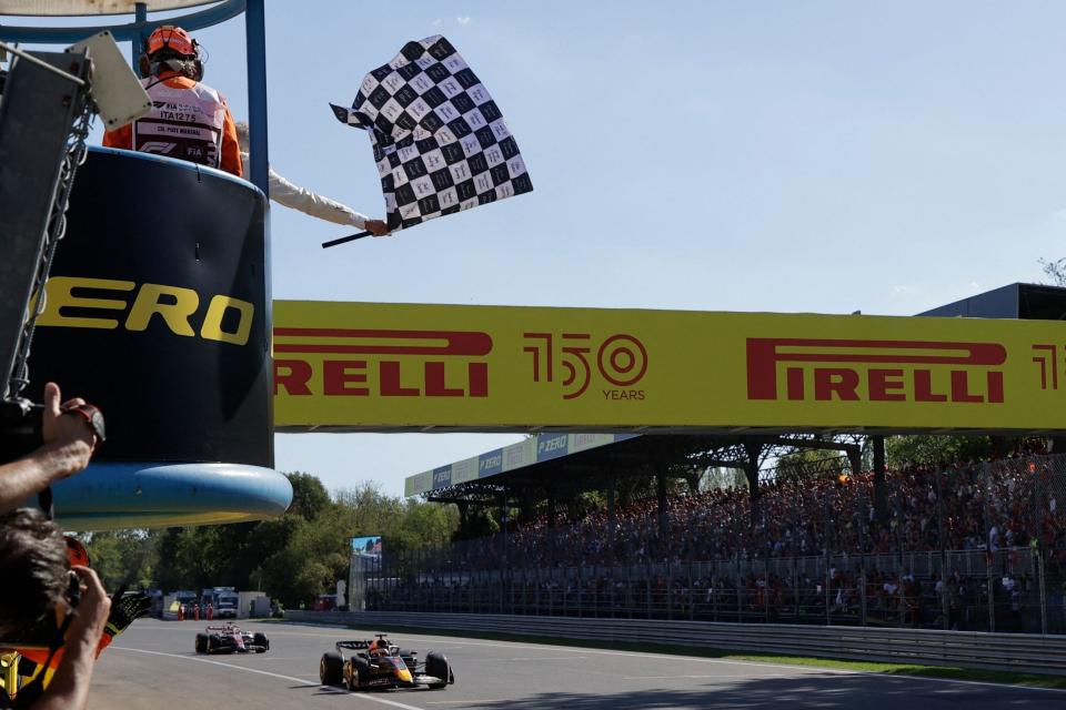 Red Bull Racing's Dutch driver Max Verstappen crosses the finish line ahead of Ferrari's Monegasque driver Charles Leclerc and wins the Italian Formula One Grand Prix at the Autodromo Nazionale circuit in Monza on September 11, 2022 - AFP