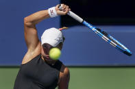 Yulia Putintseva, of Kazakhstan, returns a shot to Jennifer Brady, of the United States, during the quarterfinals of the US Open tennis championships, Tuesday, Sept. 8, 2020, in New York. (AP Photo/Seth Wenig)
