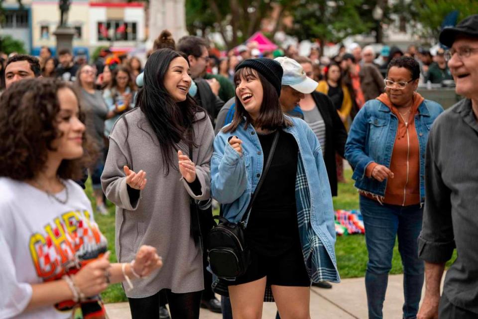 Andrea Gil and Sophia Garcia, center, enjoy the music at the Concerts in the Park which kicked off it’s first event on Cinco de Mayo at Cesar Chavez Plaza.