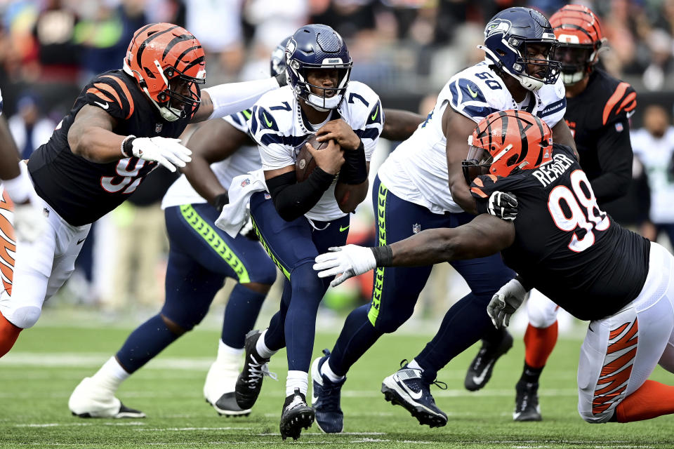 The Bengals beat up the Seahawks' Geno Smith on Sunday, sacking him four times. (AP Photo/Emilee Chinn)