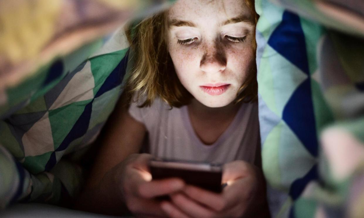 <span>The hard-hitting report said children needed to be protected from the tech industry ‘using all forms of cognitive bias to shut [them] away on their screens’.</span><span>Photograph: Westend61/Getty Images</span>