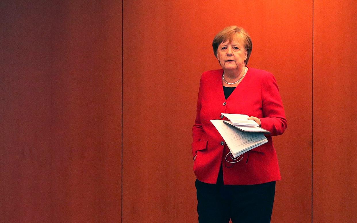 German Chancellor Angela Merkel - The importance of the coronavirus R rate in other countries across the globe - GETTY IMAGES
