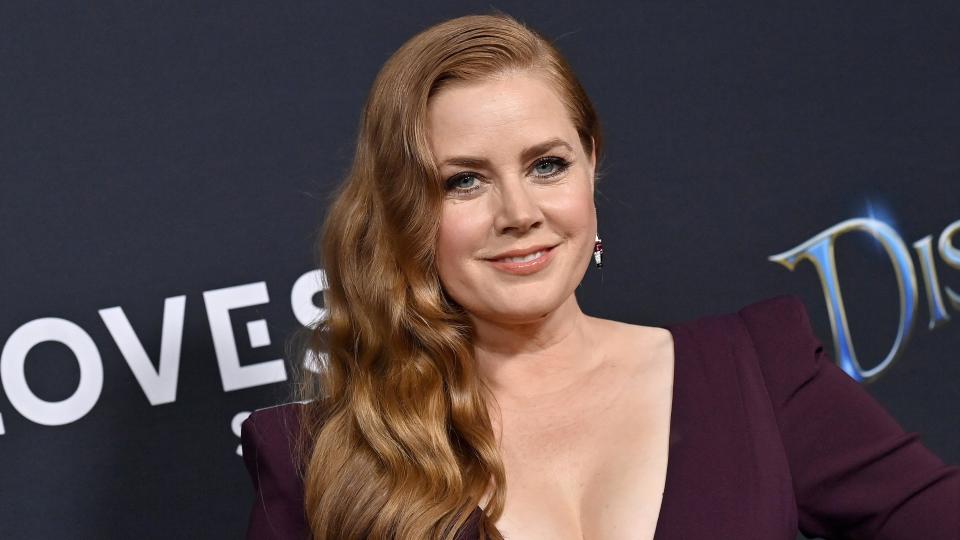 Amy Adams with golden copper hair, attends Disney's 